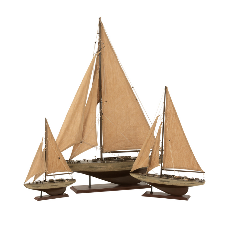 Decorative wooden sailboat with natural fabric sails displayed on white background.