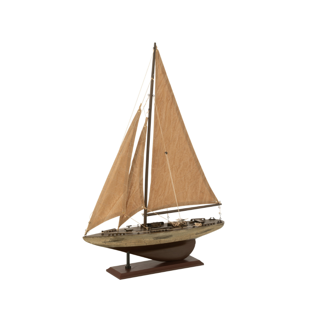 Paulownia wooden sailboat shown from a front angle with beige sails and wooden base.