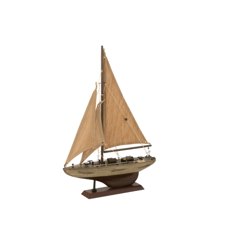 Paulownia wooden sailboat shown from a front angle with beige sails and wooden base.