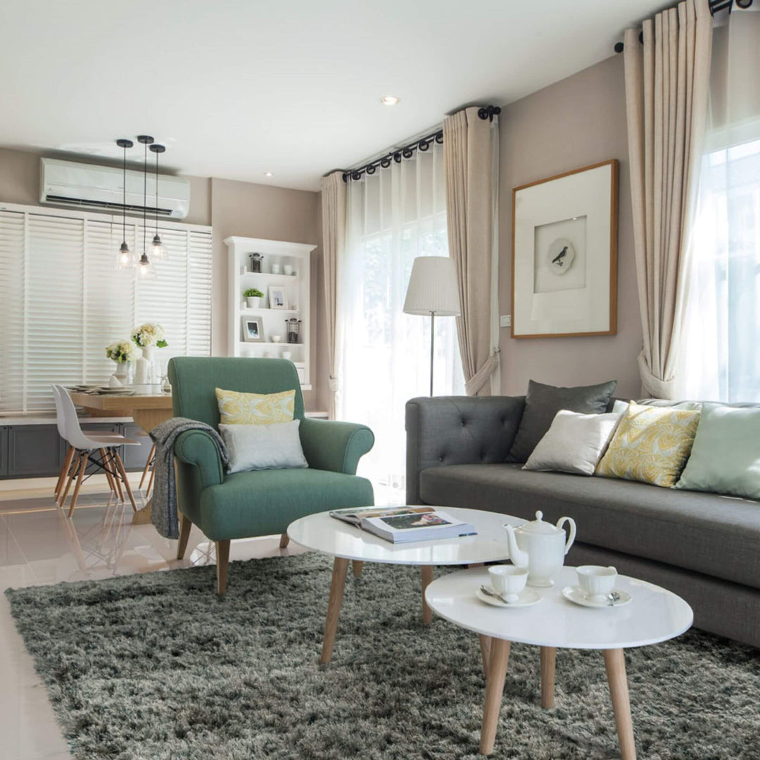 Living room interior featuring the Pella rug in a neutral tone.