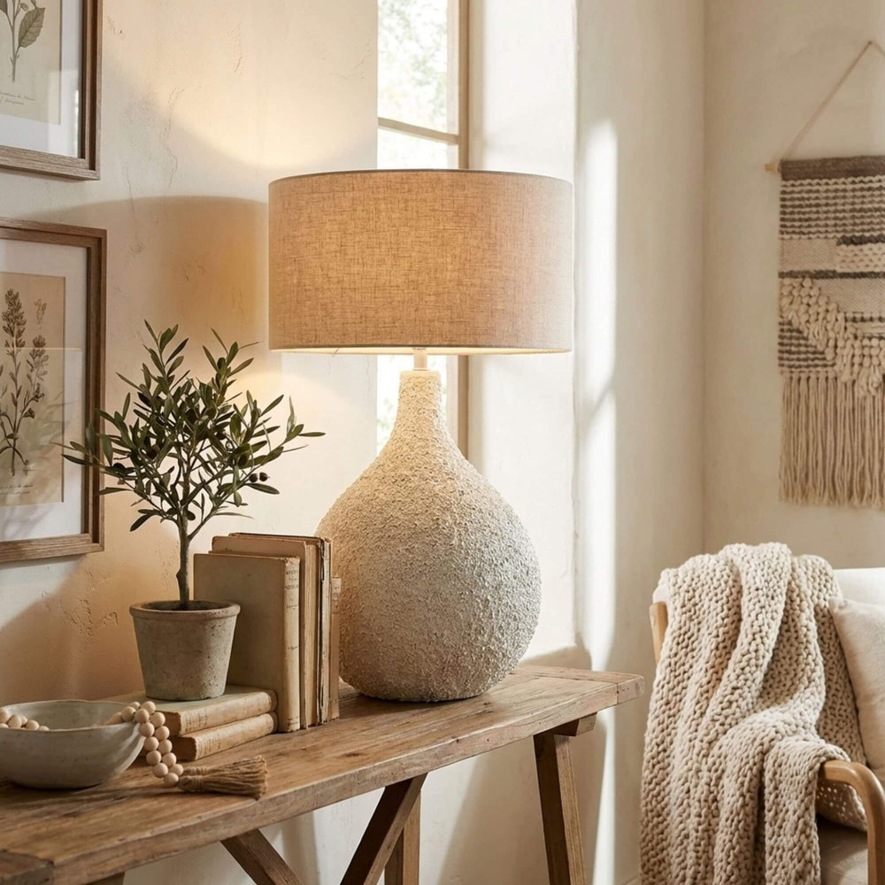Styled interior setting featuring the Pemba lamp on a wooden console table with natural decor.