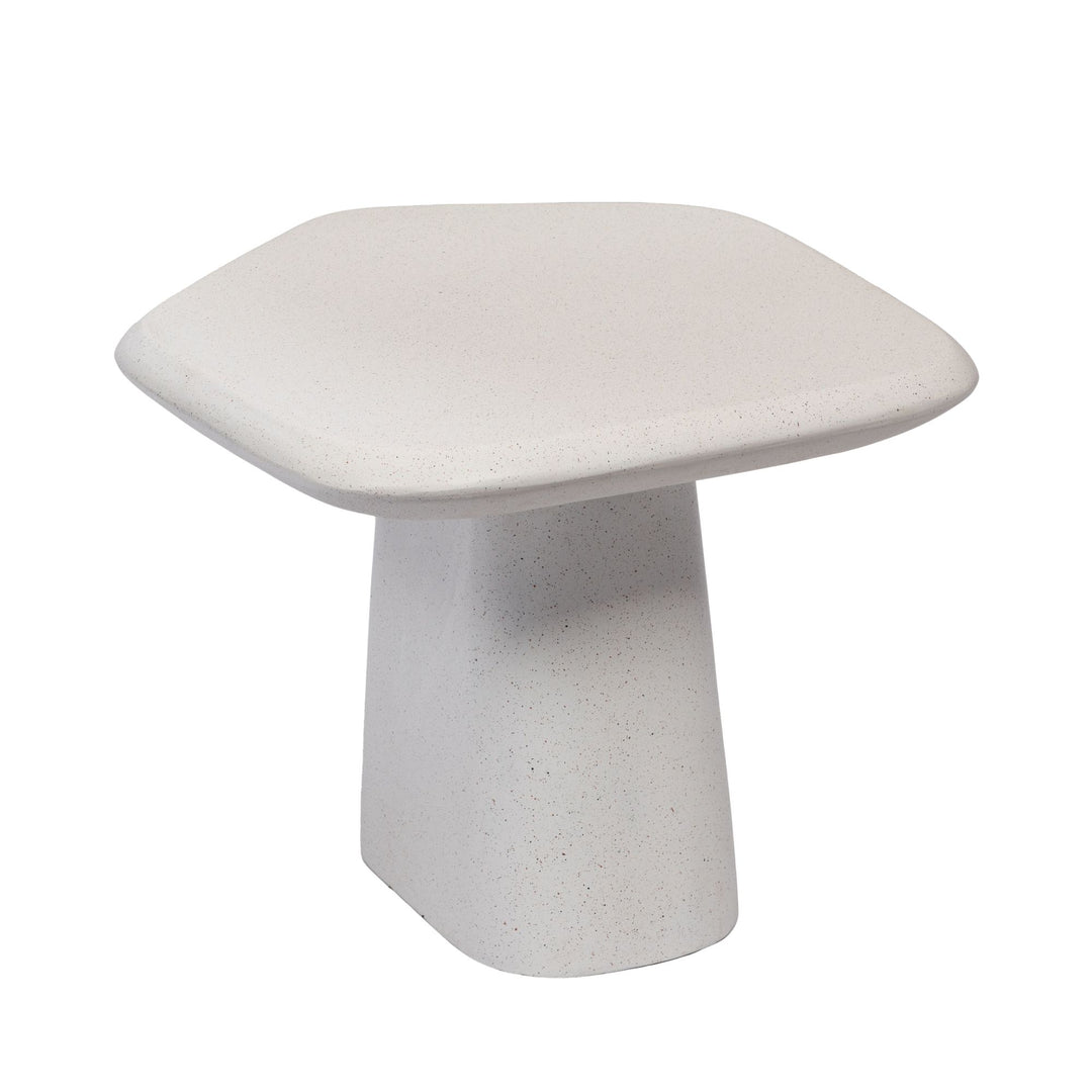 Front angled view of the Pietra coffee table showing its organic rounded top and sculptural pedestal base.