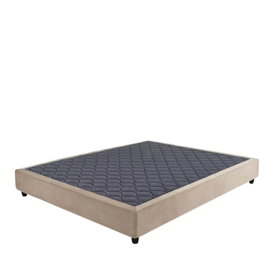 Studio image of the Positano Bed Base with upholstered perimeter and quilted top surface.