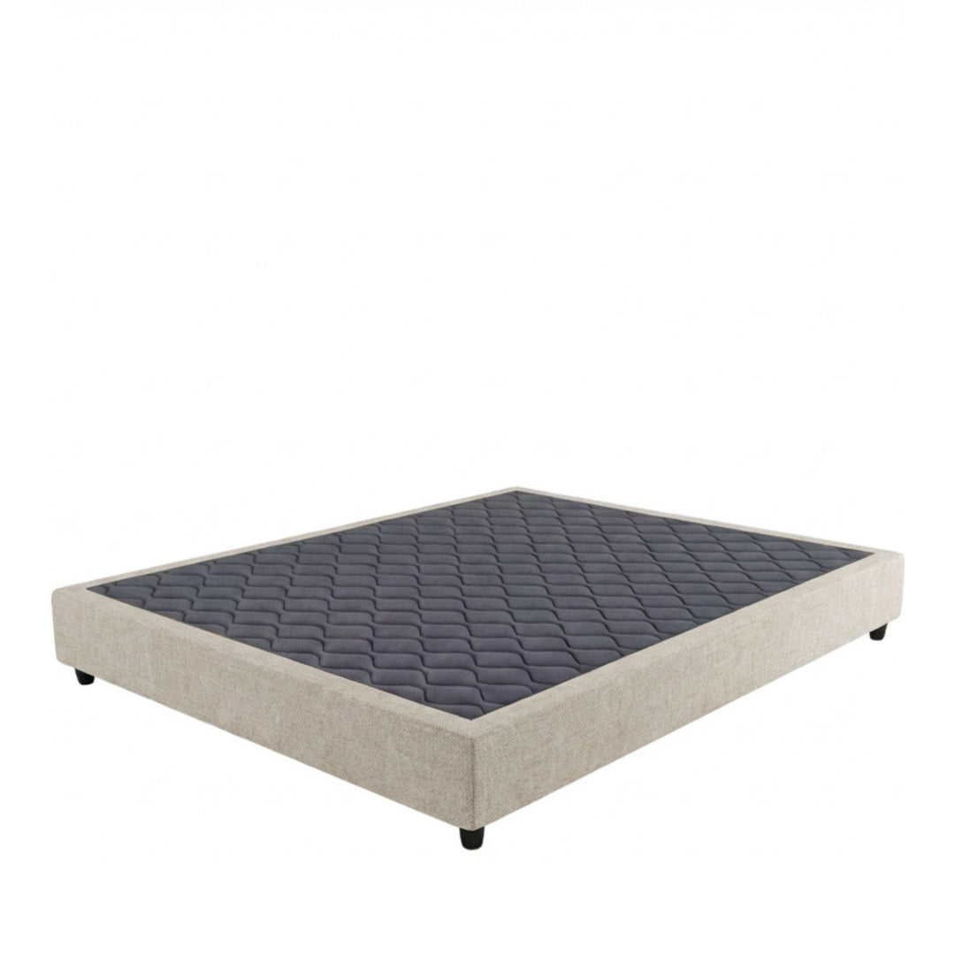Studio image of the Positano Bed Base with upholstered perimeter and quilted top surface.