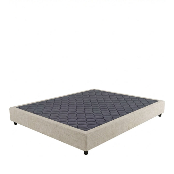 Studio image of the Positano Bed Base with upholstered perimeter and quilted top surface.