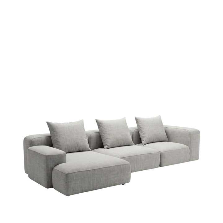 1. Positano chaise longue sofa shown in a soft grey neutral upholstery with deep seating and relaxed cushions
