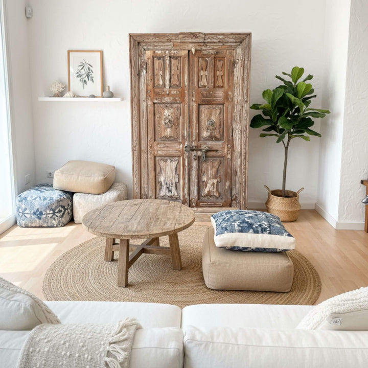 Living room setting with the Pradesh wardrobe styled among soft furnishings.