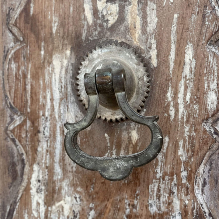 Detail of the antique metal ring handle on the Pradesh wardrobe.