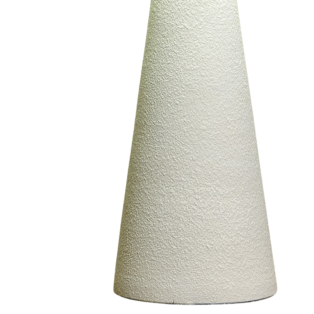 Detail of Prana lamp’s tapered base in natural wood texture.