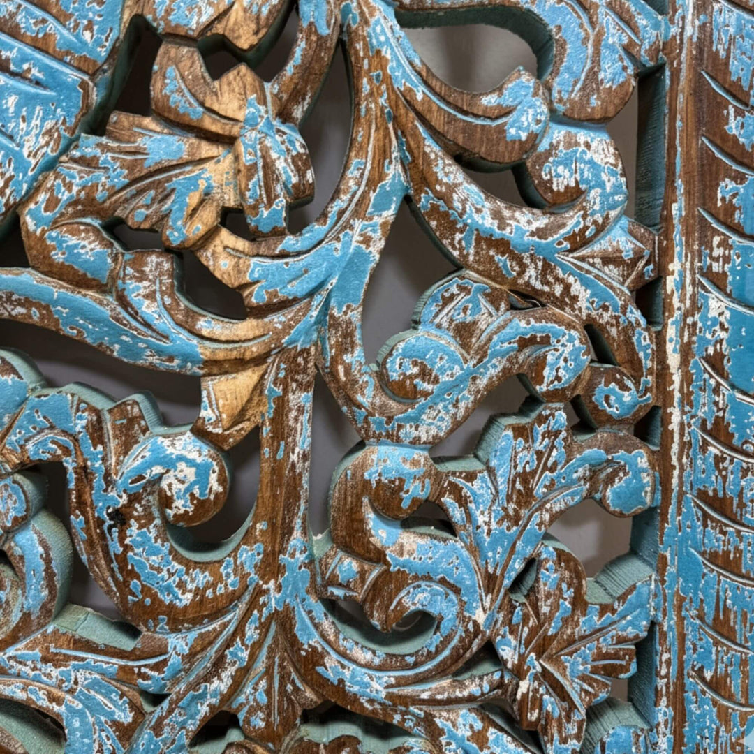 Detailed carving showing the distressed texture and craftsmanship of the Punsari Wall Deco.