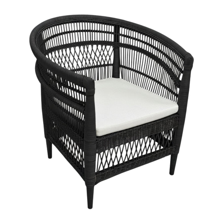 Angled view of the black rattan weave and teak frame of the Punta Blanca Chair.