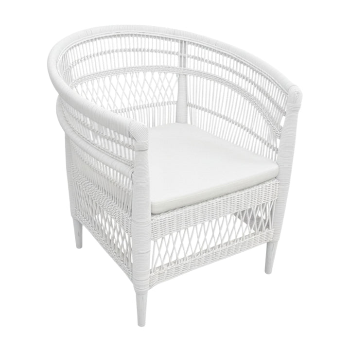 Angled view of the Punta Blanca Chair made of white rattan and teak wood.