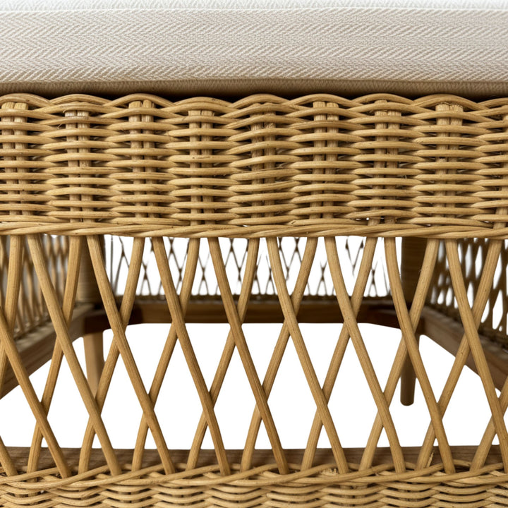 Close-up of the armrest showcasing the curved rattan craftsmanship.