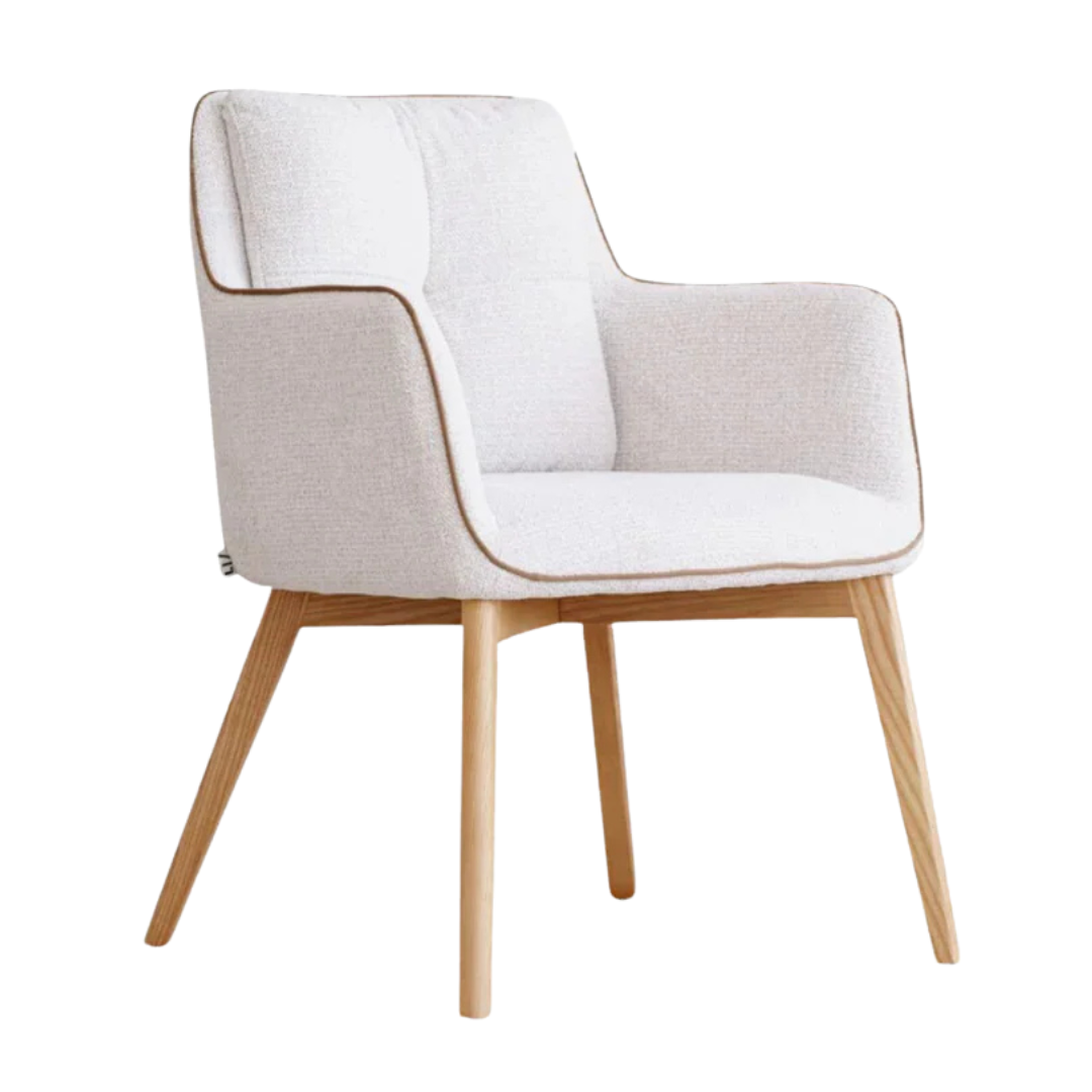 Angled ivory dining chair with cushioned seat and armrests.