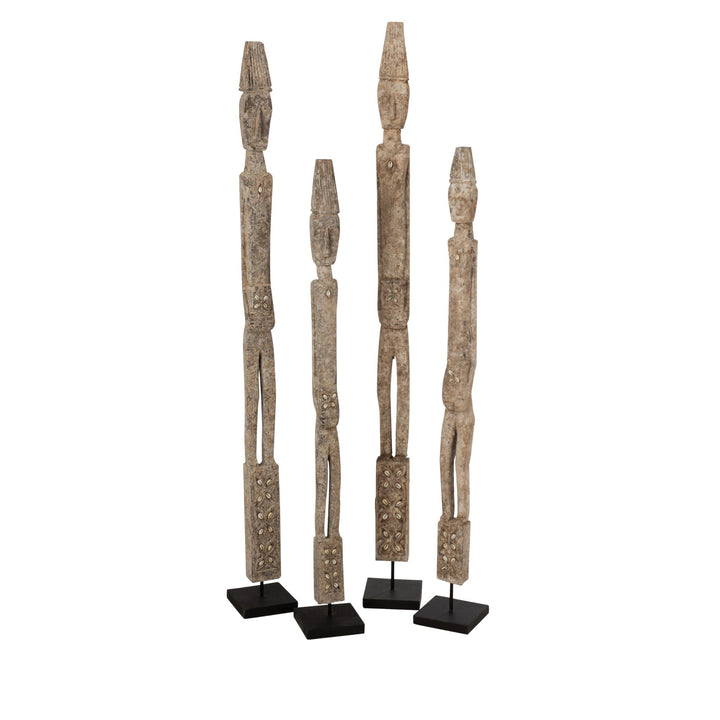 Set of Quitos wood sculptures displayed together showing variations in handcrafted texture and height.