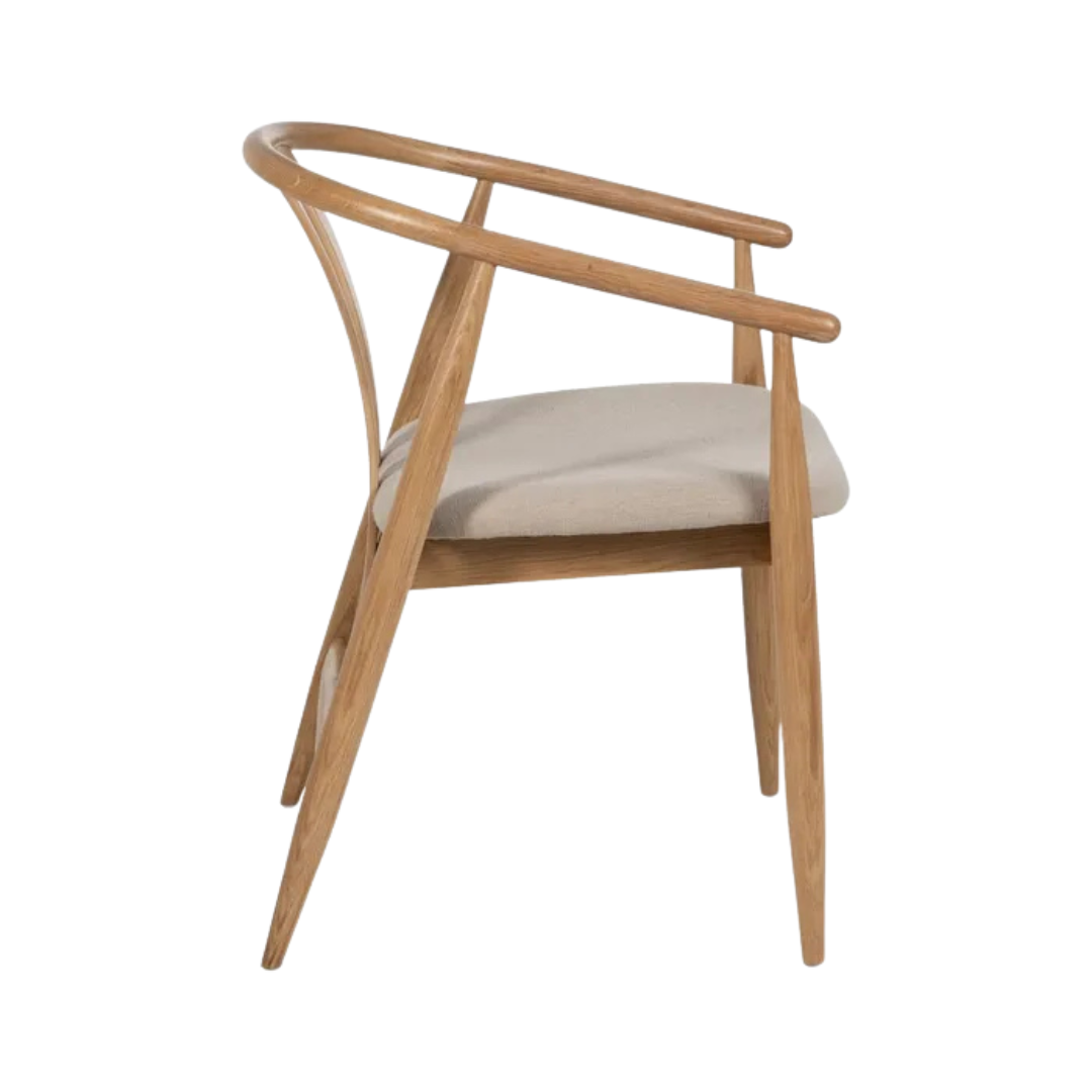 Side profile of Rabat oak dining chair showing oak frame and upholstered cushion