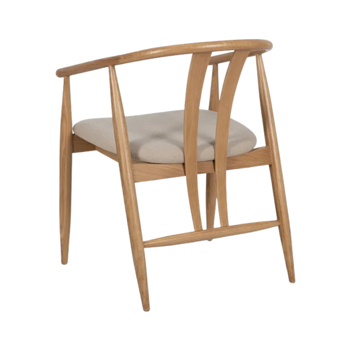 Angled view highlighting natural oak grain and contemporary dining chair design