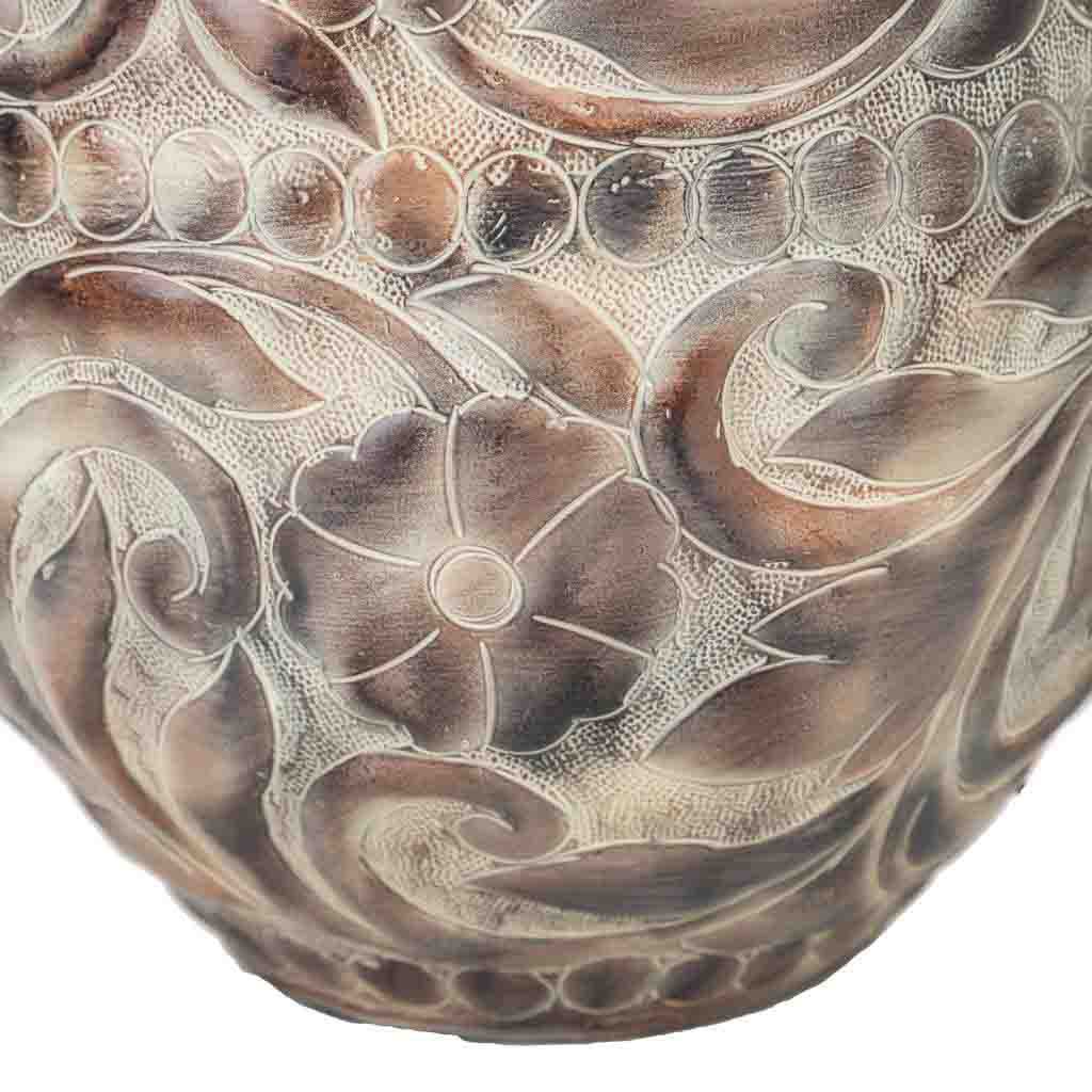 Close-up of the marbled earth-tone finish on the Radon lamp’s iron base.