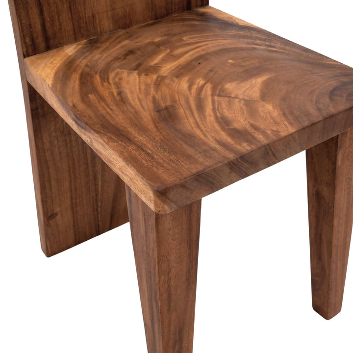 Close-up detail of the chair seat and legs showing the rich suar wood grain and handcrafted construction.