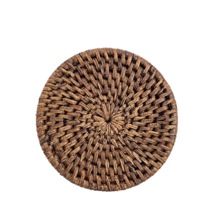 Top view of a single rattan coaster showing its circular woven pattern and natural texture.