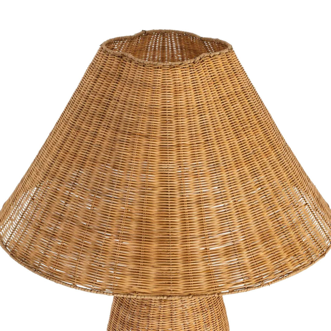 Front angled view of the lamp highlighting its handcrafted rattan texture and elegant silhouette.