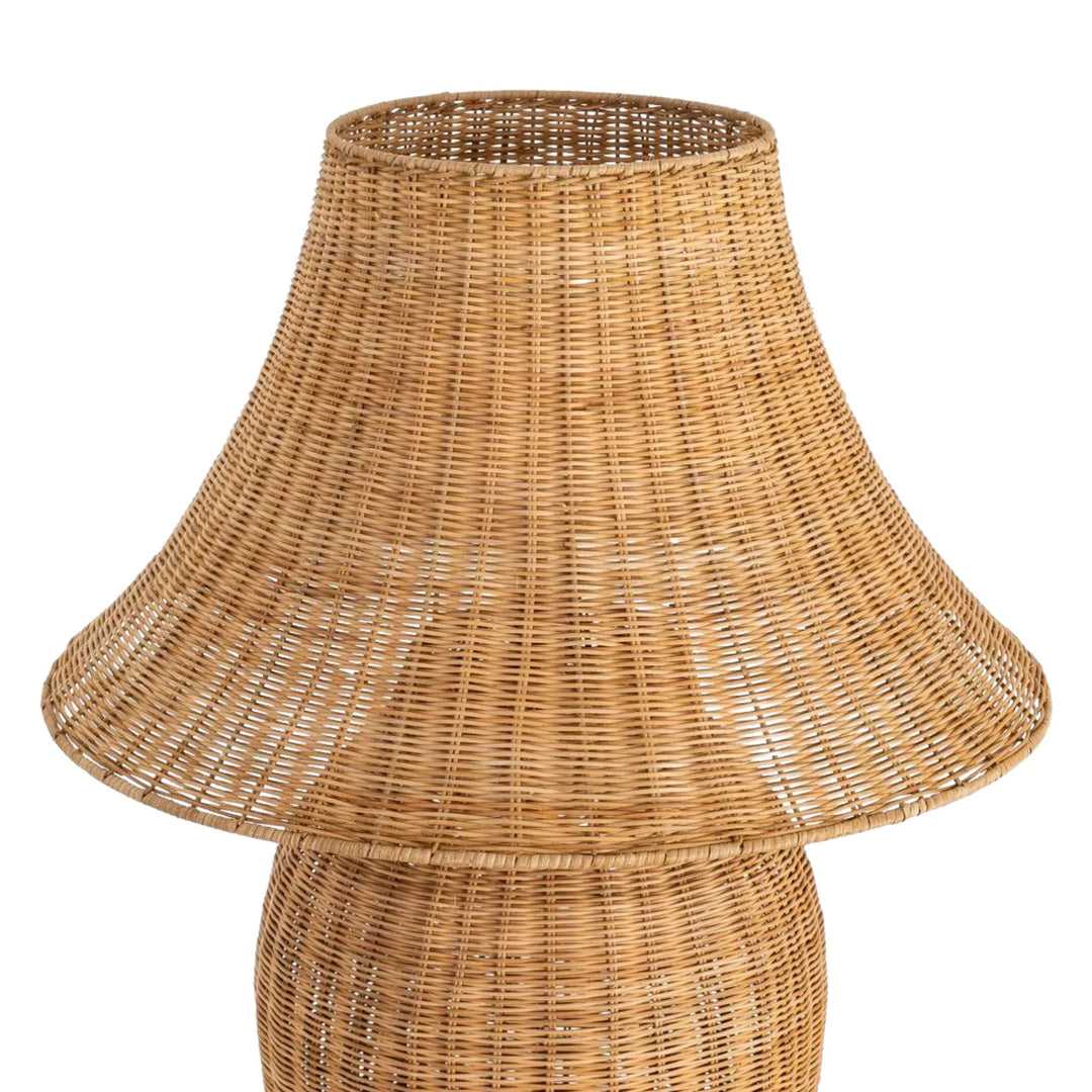 Front angled view of the lamp highlighting its organic silhouette and woven rattan texture.