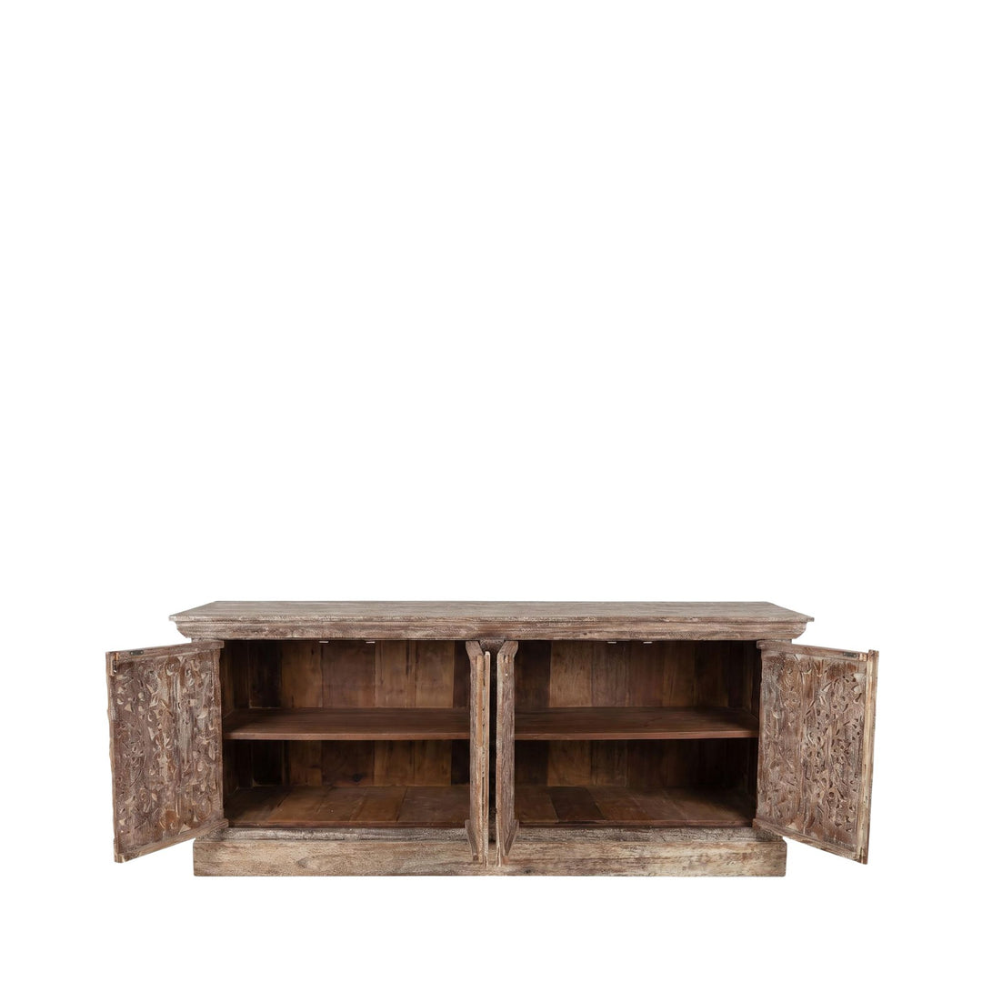Open cabinet view showing the interior shelving and storage space behind the carved doors.
