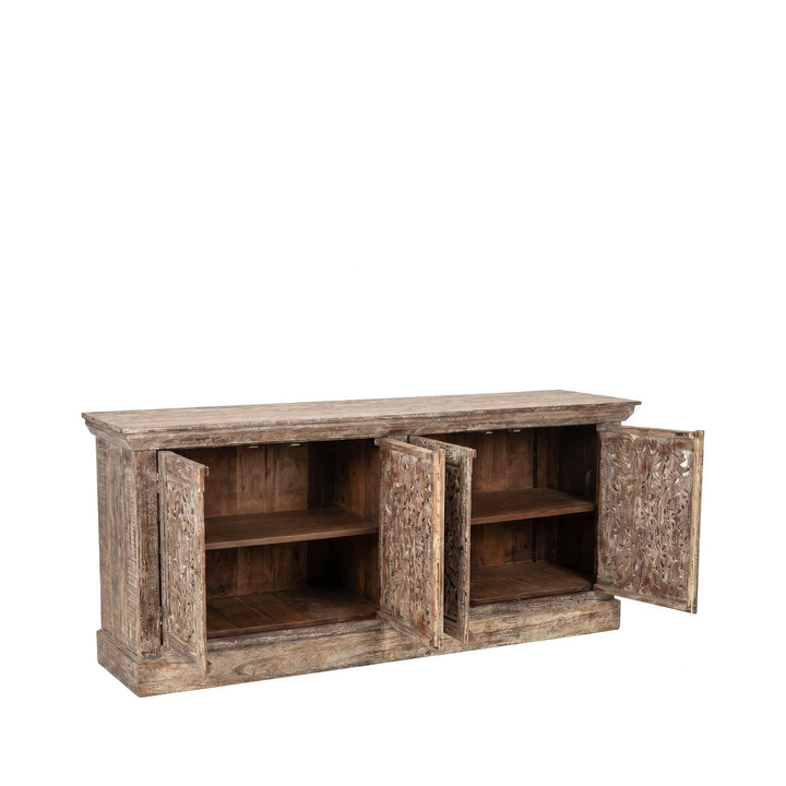 Open cabinet view showing the interior shelving and storage space behind the carved doors.