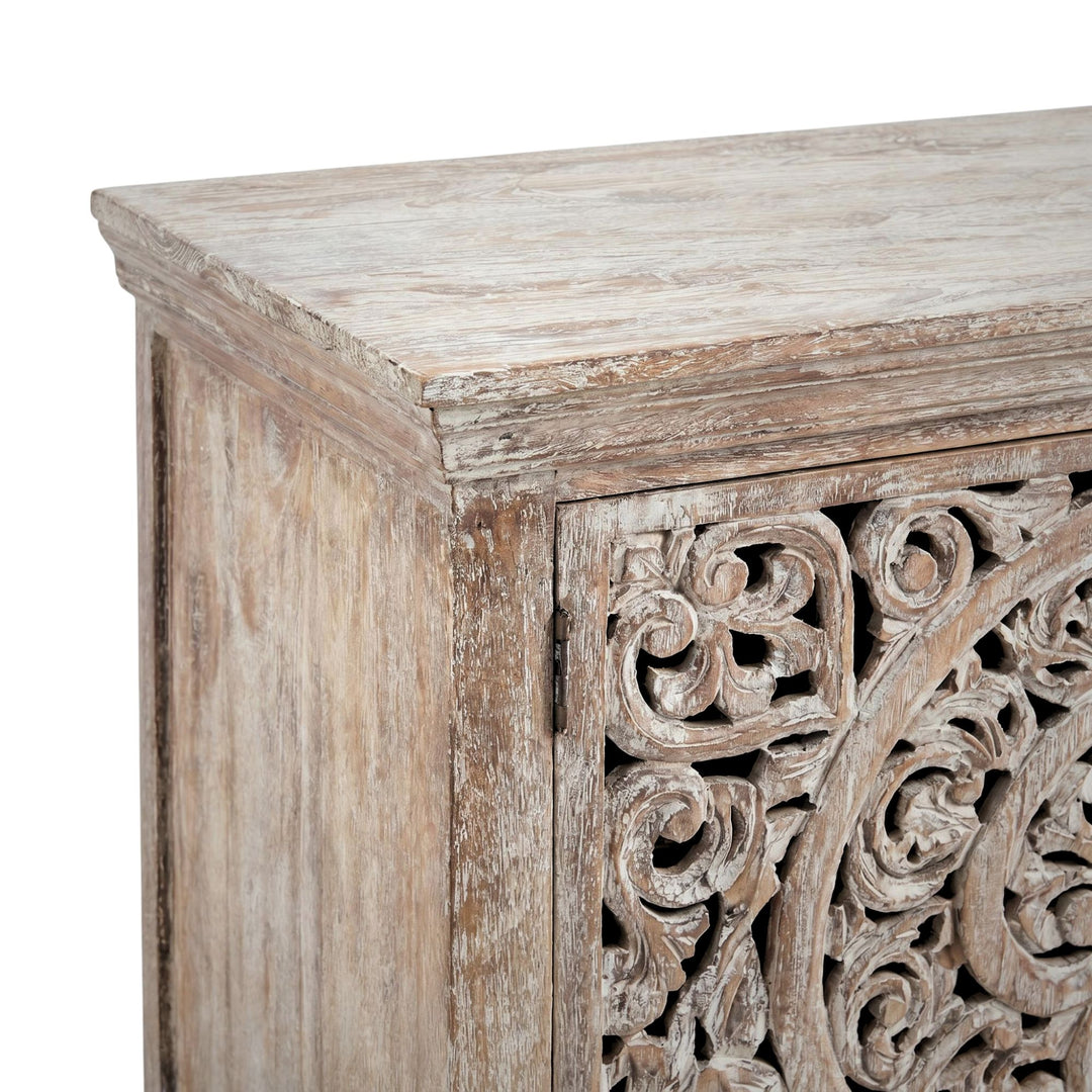Front angled view of the buffet highlighting its carved door panels and solid teak wood structure.