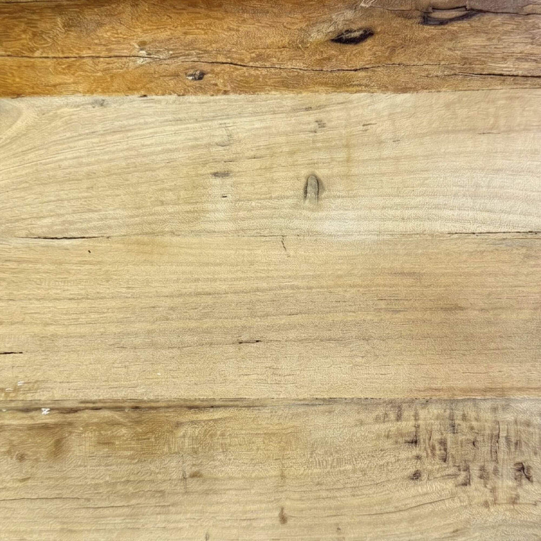 Close-up detail of the wood surface showing the reclaimed grain, texture, and natural tonal variation.