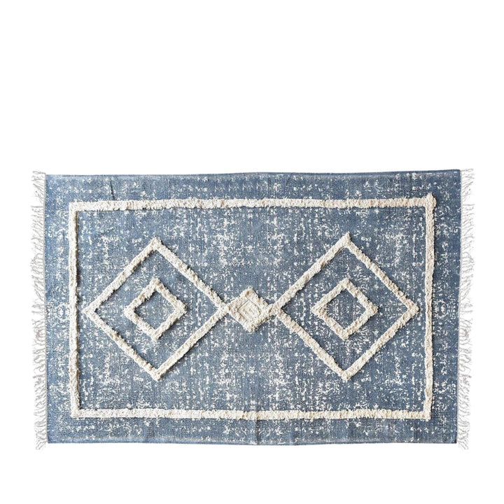 Front view of the Refren Rug showing geometric diamond motifs in soft blue and off-white tones.