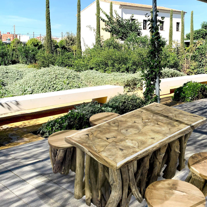 “Rustic style teak root coffee table for indoor or covered outdoor spaces.”