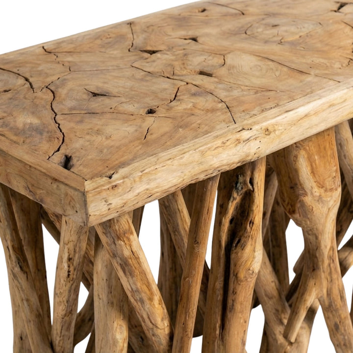 Close up of Rimatara teak wood coffee table with natural branch-like design on a white background