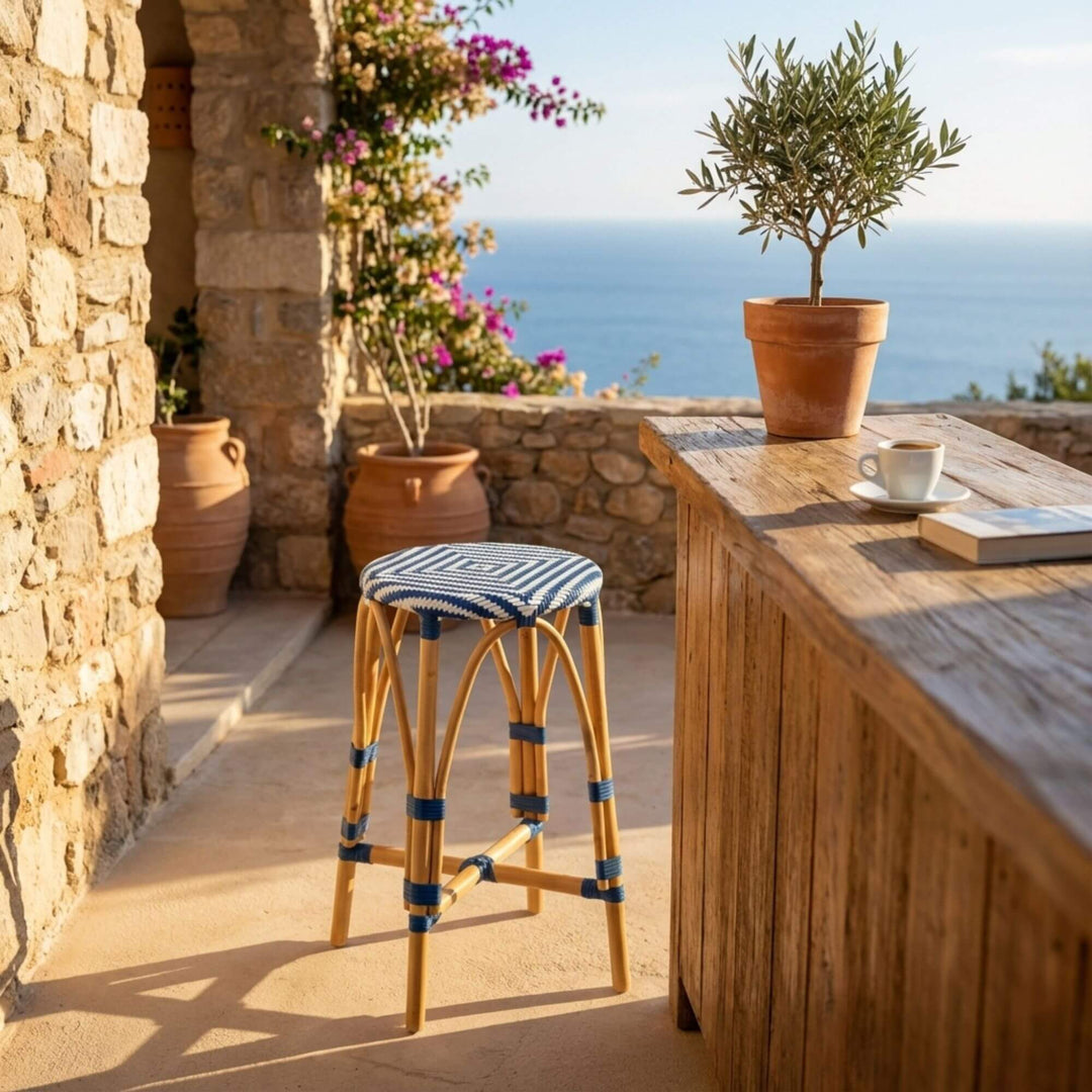 Styled outdoor terrace view of Riviera Bistro Kitchen Stool placed at a counter, highlighting its bistro-inspired design.