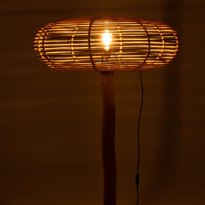 Close-up of Robi floor lamp glowing warmly at night