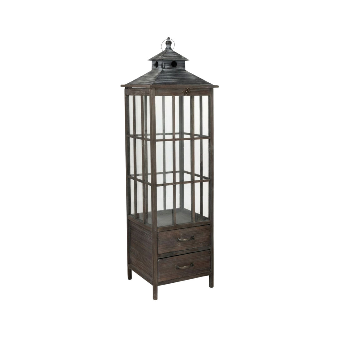 Single Roman lantern isolated on white background highlighting its vertical form and handcrafted wood base.