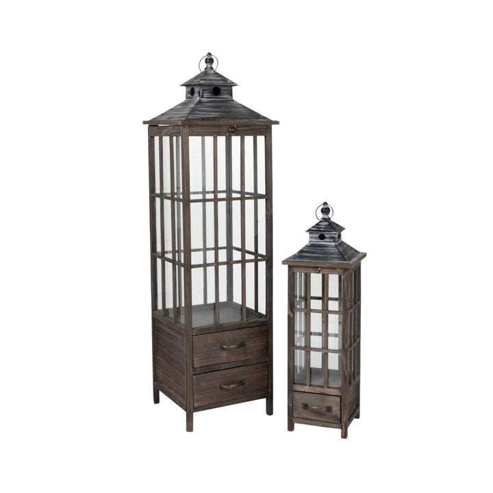 Front view of Roman wooden lanterns in two sizes showcasing their tall architectural structure and glass panels.