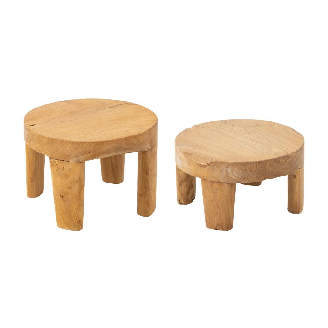 Group view of Rurutu Coffee Tables in two heights showing their rounded silhouette and solid legs.