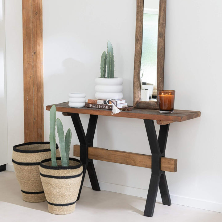 Lifestyle: rustic industrial console styled in entryway with decor.