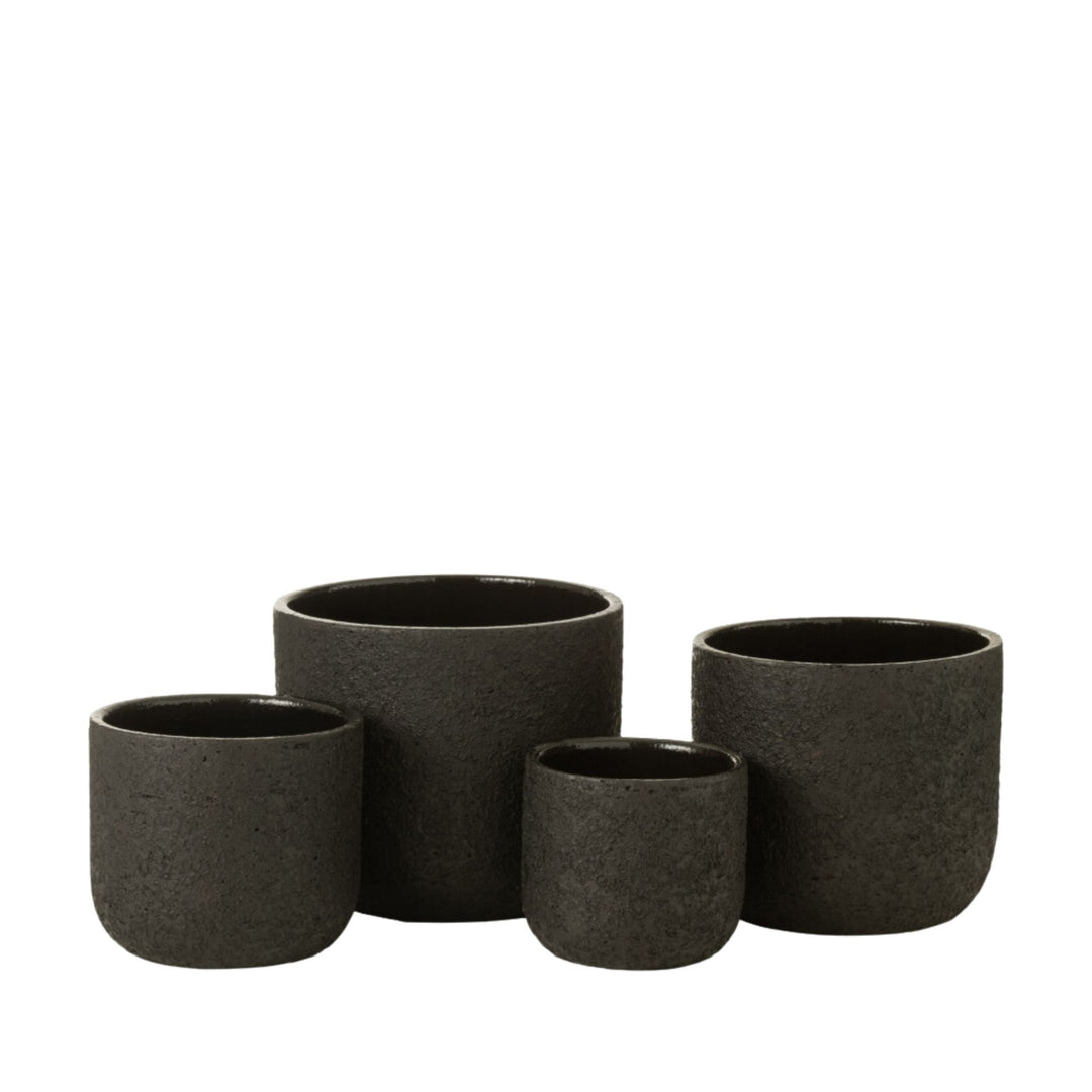 Group view of Rustic ceramic pots in various sizes with matte textured finish.