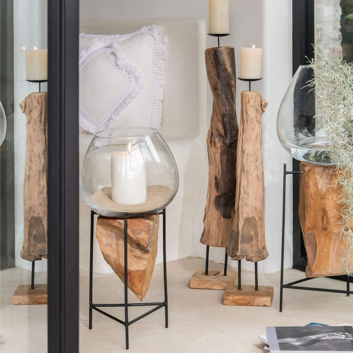 Interior setting featuring Rututu teak root stand with lamp and décor