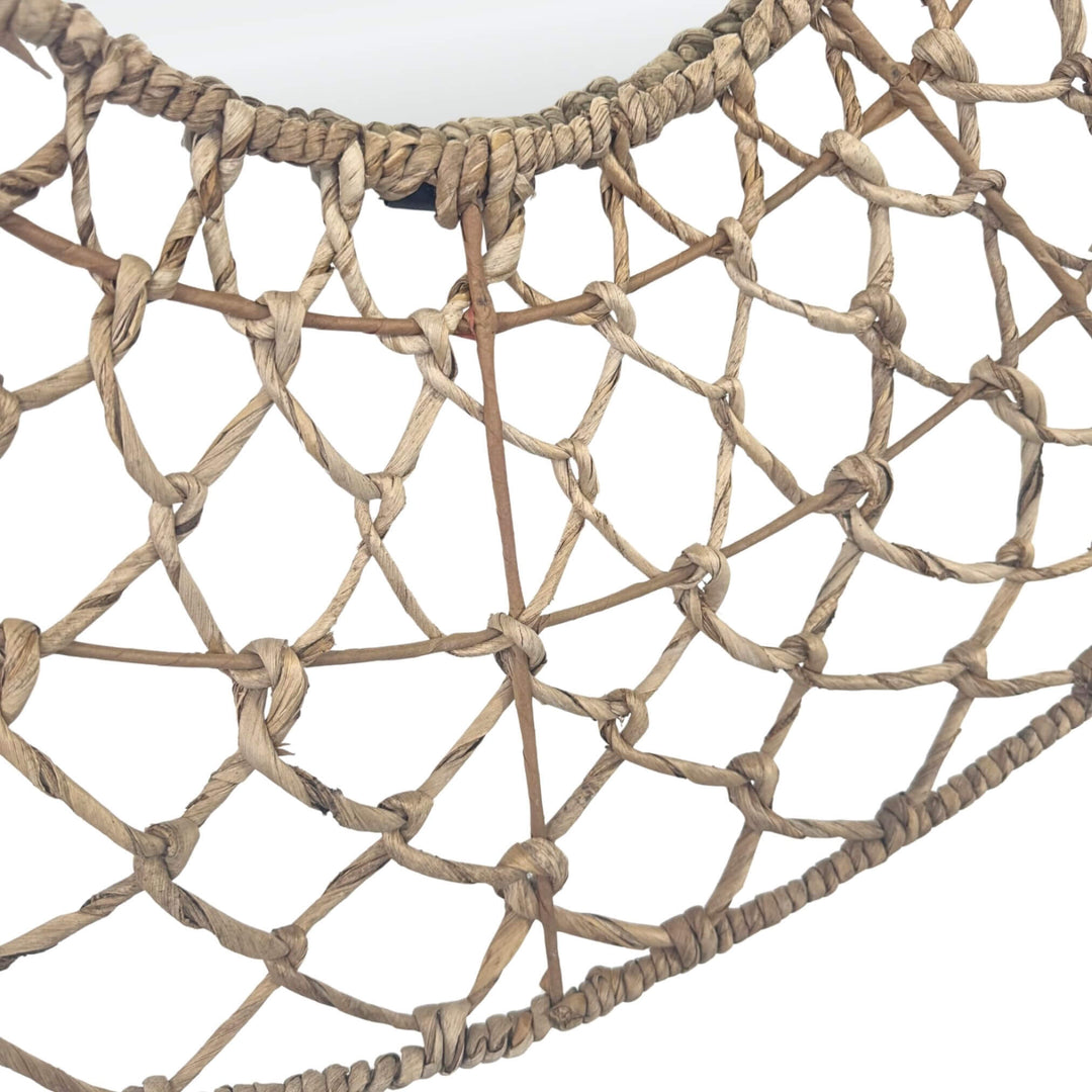 Close-up of handwoven banana leaf weave on Ruwe mirror.