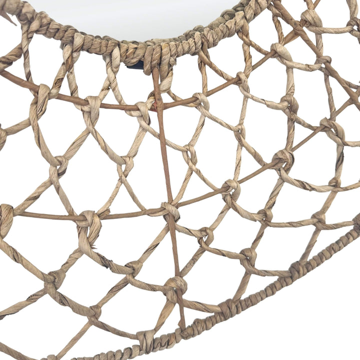 Close-up of handwoven banana leaf weave on Ruwe mirror.