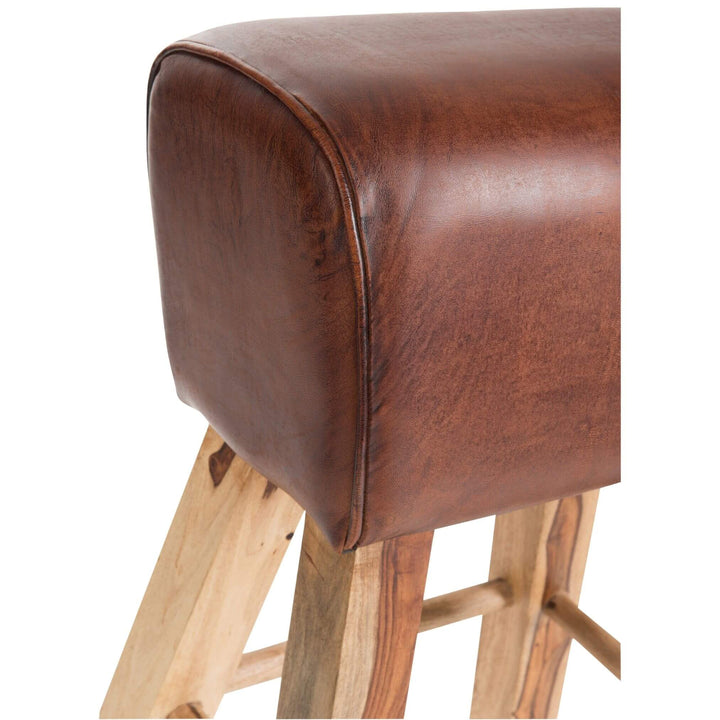 Close-up of brown leather seat and wooden legs on Rock Bar Stool
