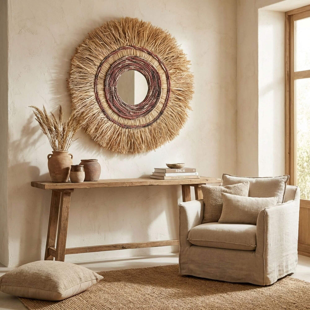 Nest living room with a textured wall Sagara mirror, wooden console table, and armchair.