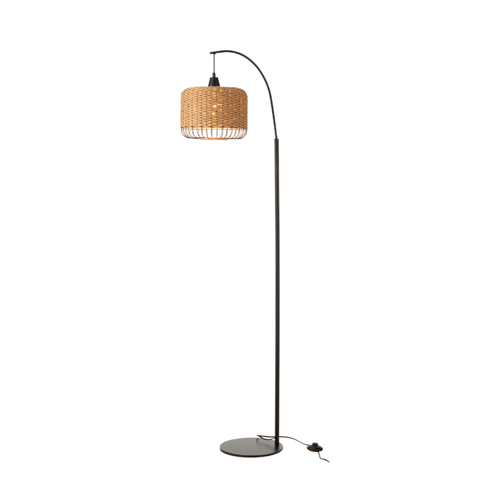 Lit Natural fiber Sahana floor lamp on slim black frame, side angle.
