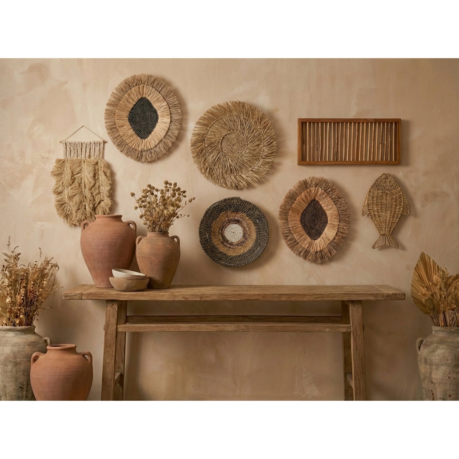 Decorative wall with woven baskets, pottery, and a wooden shelf against a beige wall.