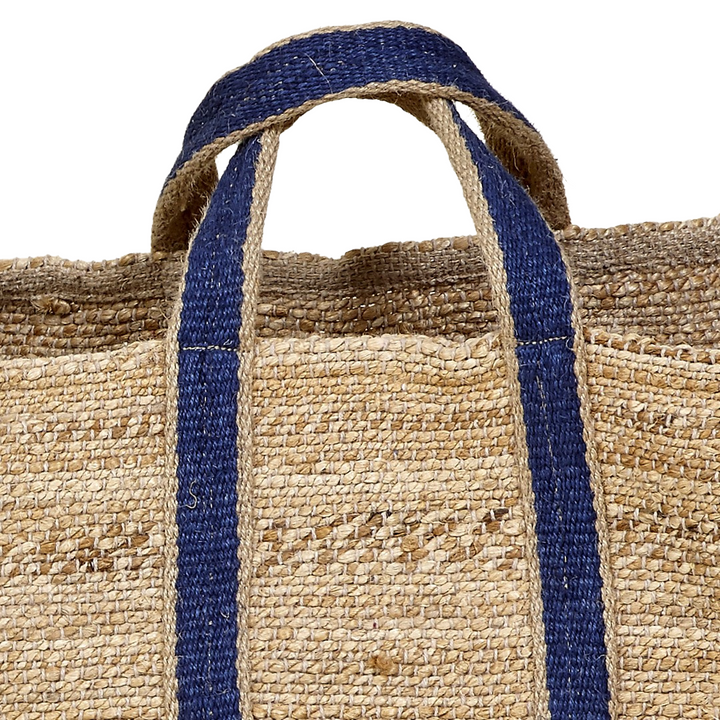 Close-up of navy handle attached to woven jute texture