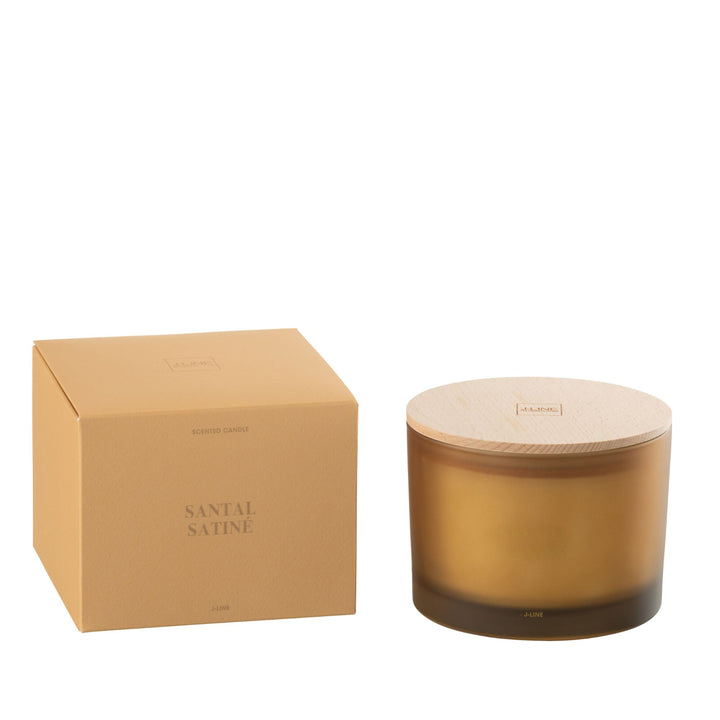 Small Santal Satiné candle beside packaging in minimalist styling.