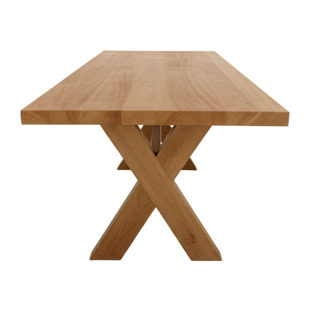 Side profile of the teak bench paired with the Santorini dining table.